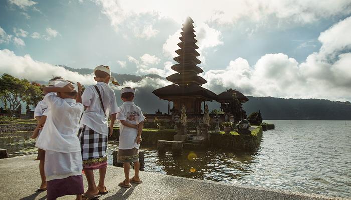 children visiting temples in Bali