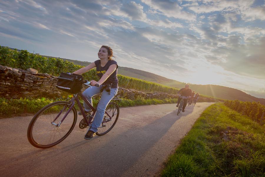 Our video takes us to a bike path in Beaune, France, where these travellers are pedalling into magic hour.