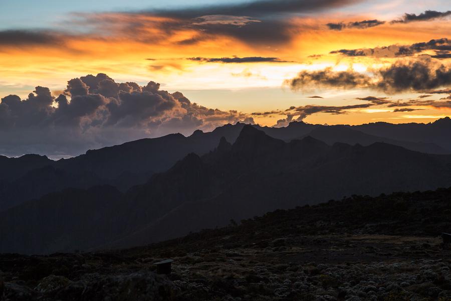 Watch the clouds part to reveal a breathtaking vista of the valleys around this dormant volcano.