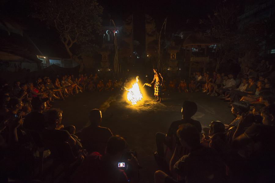 The Balinese black-and-white checked poleng cloth symbolizes the balance of the universe