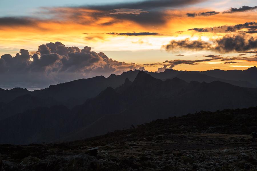 See the skies come alive with colour as the sun sets on another day over Kilimanjaro’s shortest peak. 