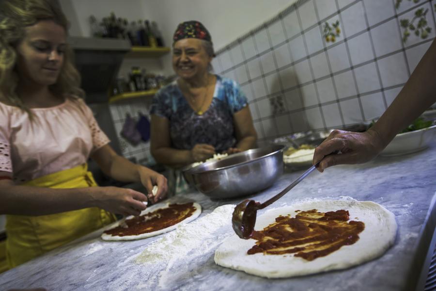 From pizza to pan con tomate, the bright red fruit is versatile and integral